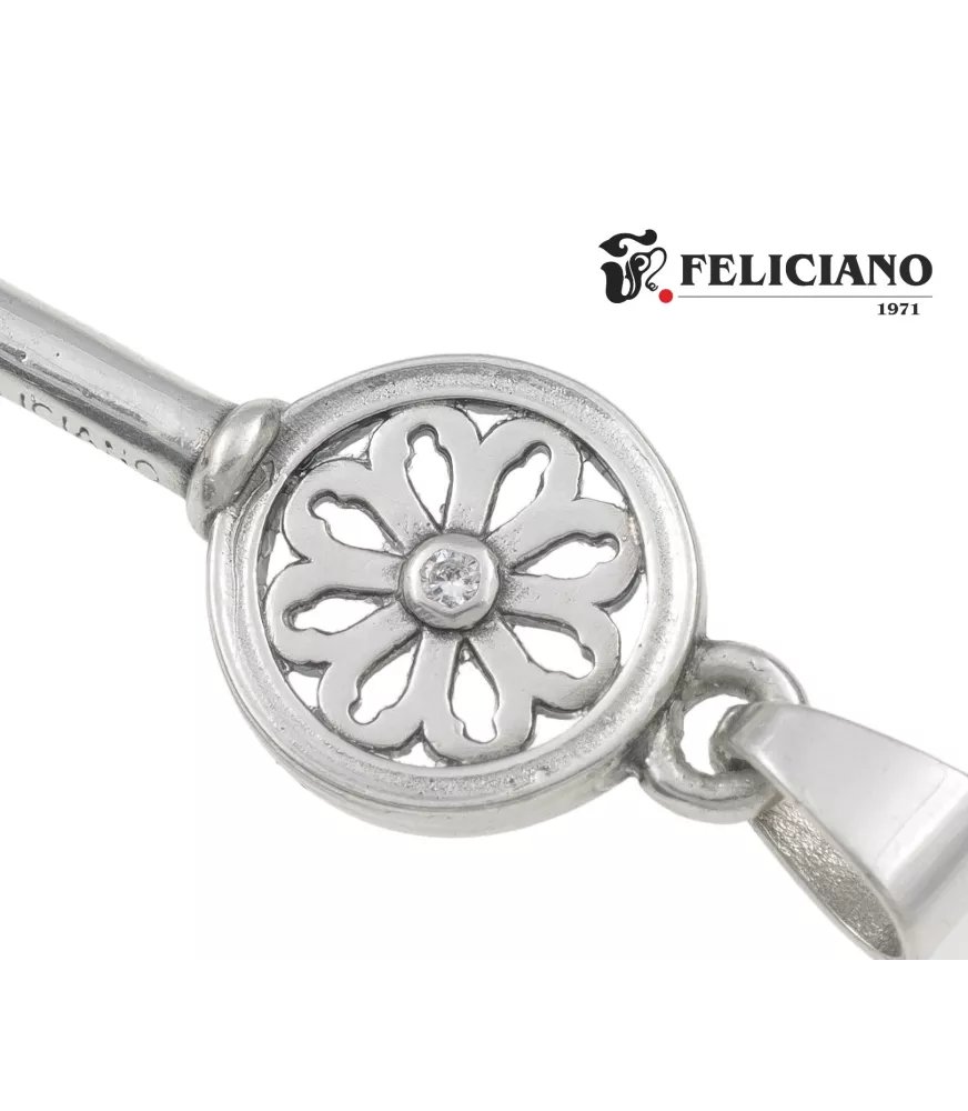 Colgante Llave pequeña sin bisel en el rosetón en plata .