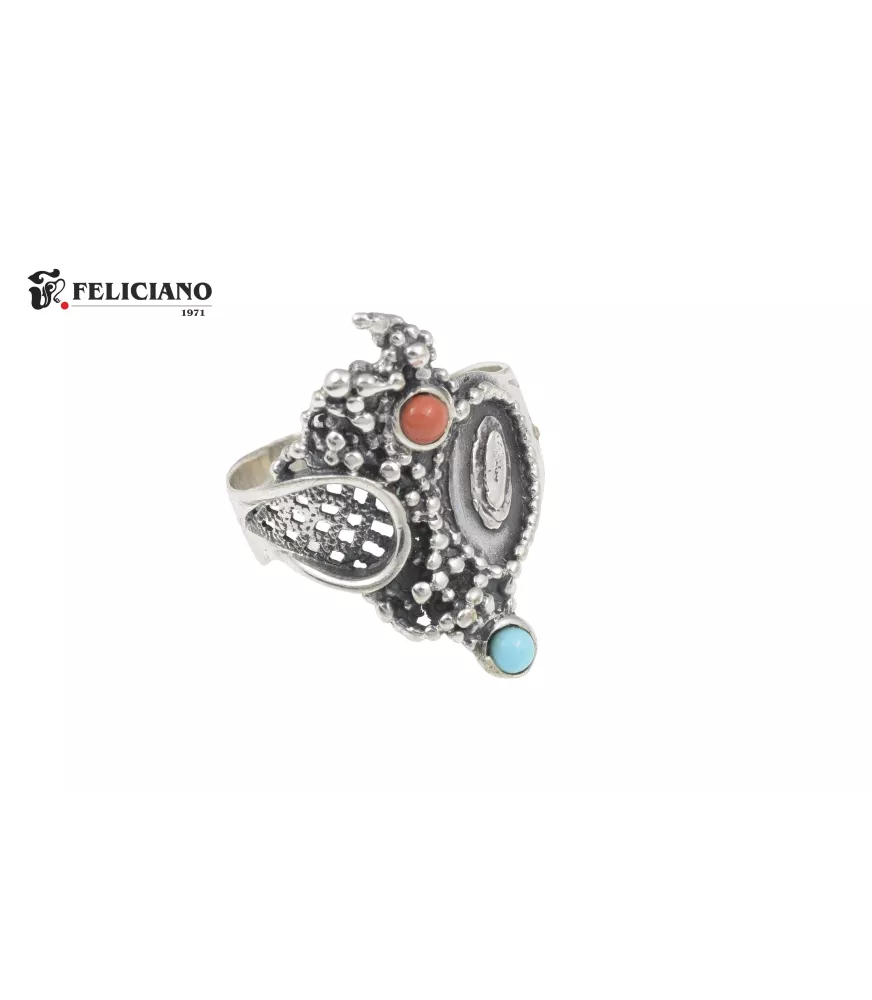 Anillo de plata, con bola turquesa y coral.