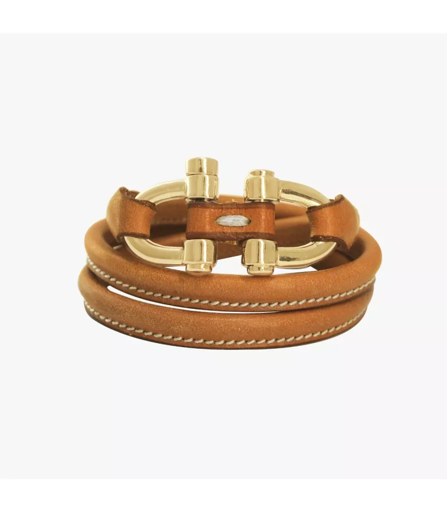 Pulsera doble Grillete Roll CXC, en metal bañado en oro, con cuero liso.