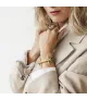 Pulsera Bit St. Moritz CXC, en metal bañado en oro y cuero camel.