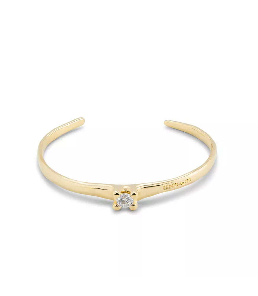 Pulsera Cosmos UNOde50, en metal bañado en oro.