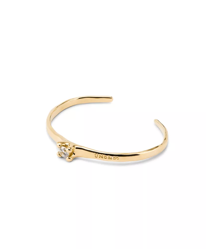 Pulsera Cosmos UNOde50, en metal bañado en oro.