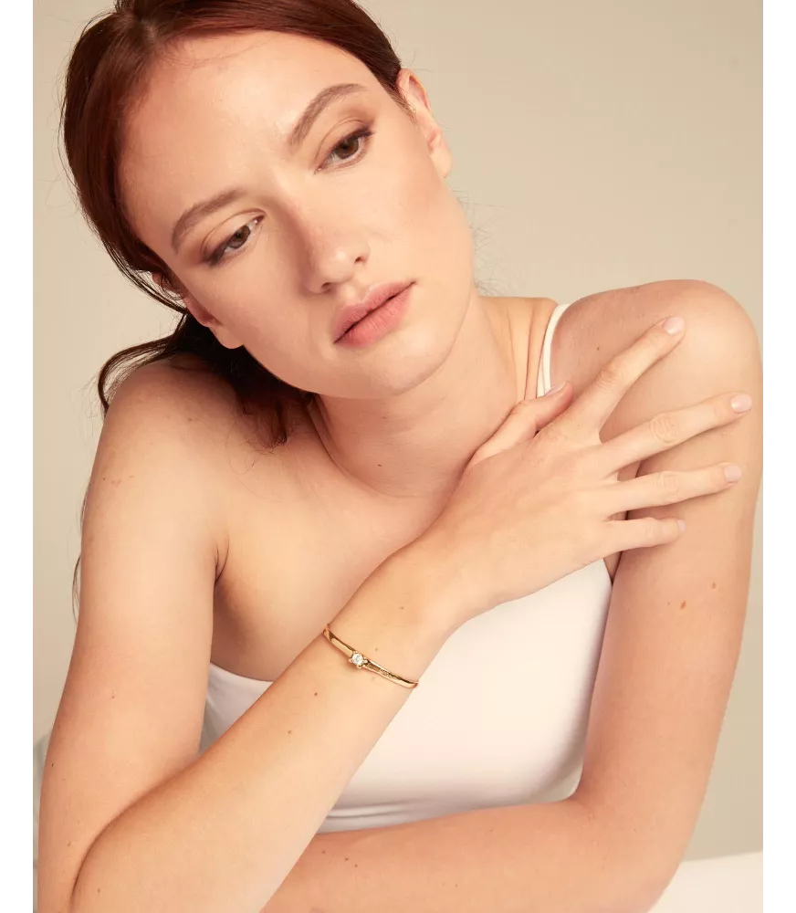 Pulsera Cosmos UNOde50, en metal bañado en oro.