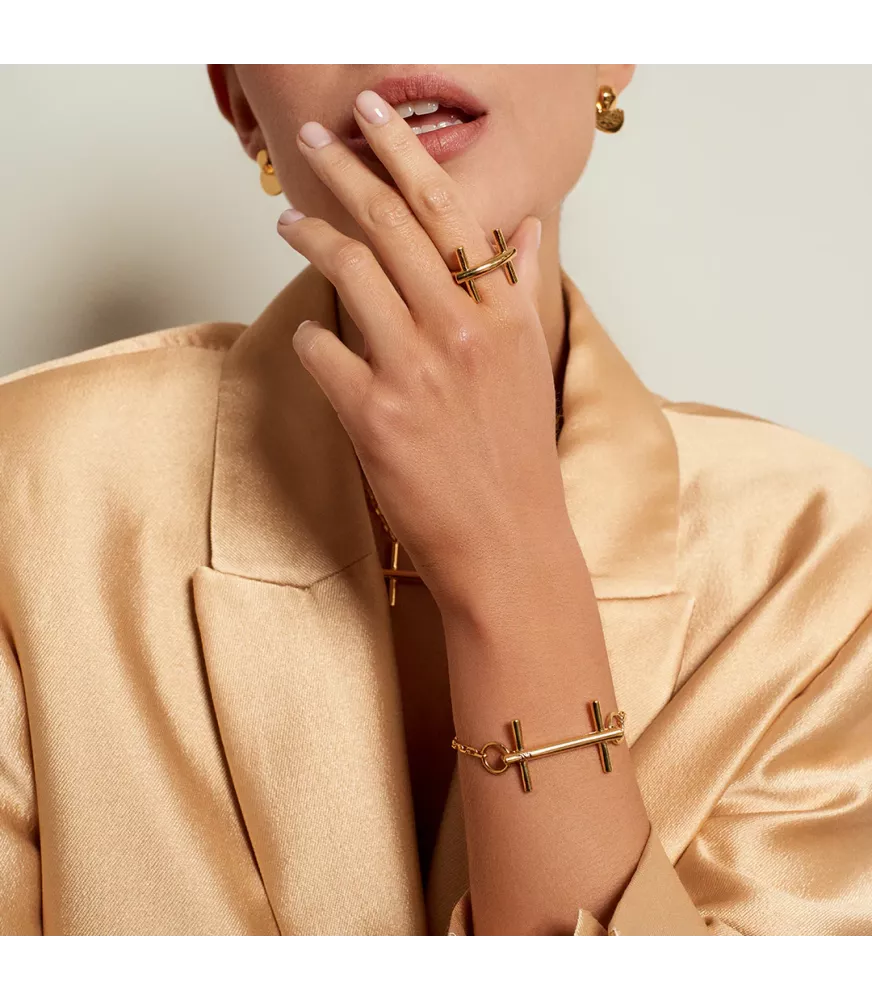 Pulsera Bit St. Moritz Slim CXC, en metal bañado en oro.